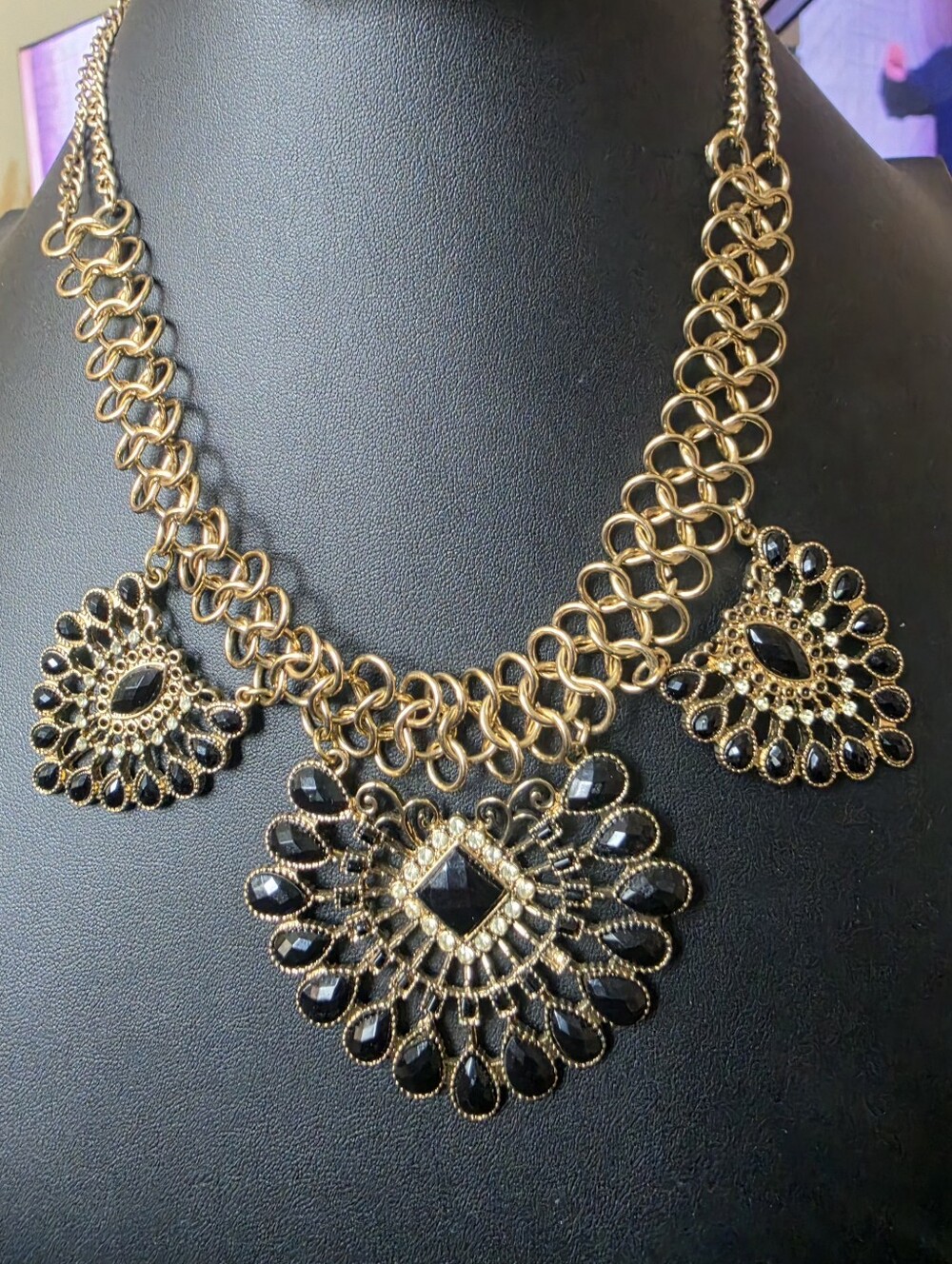 Egyptian Revival style gold-tone bib statement necklace is a bold and eye-catchi